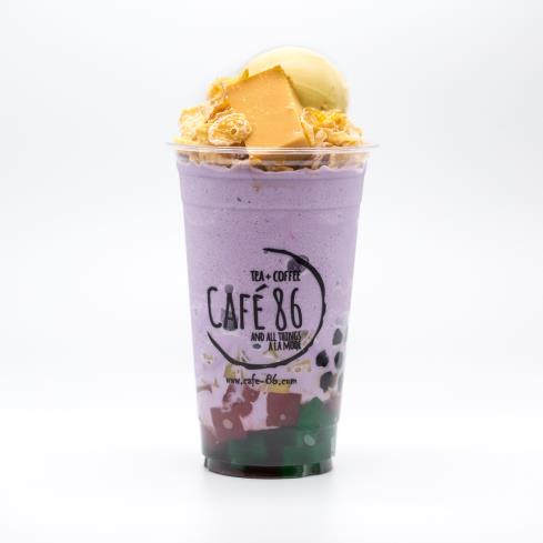 Café 86 specialty drink in a branded cup.